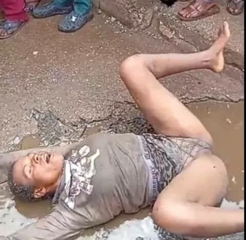 Video || Shameless People Watch A Mad Young Lady Rolling In Mud